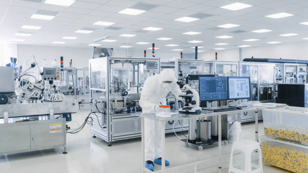 A lab technician analyzing and checking the efficacy of a pharmaceutical drug in the laboratory surrounded by manufacturing & quality control systems. - By Dolvis Bio Pharma (PCD Pharma Franchise in Delhi). https://dolvisbio.com/