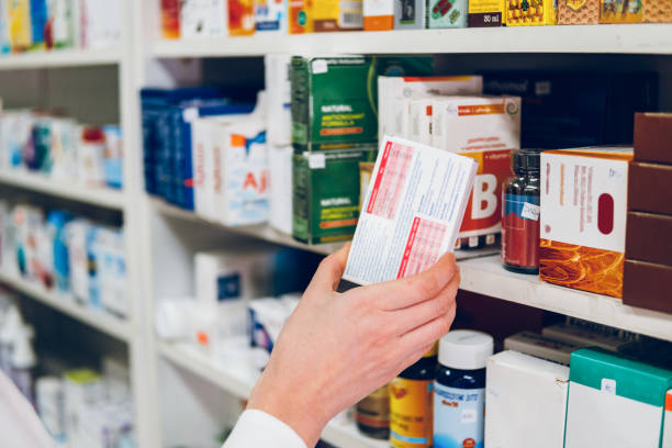 A person is taking a medicine box from a rack full of medicines.  - By Dolvis Bio Pharma (PCD Pharma Franchise in Delhi). https://dolvisbio.com/